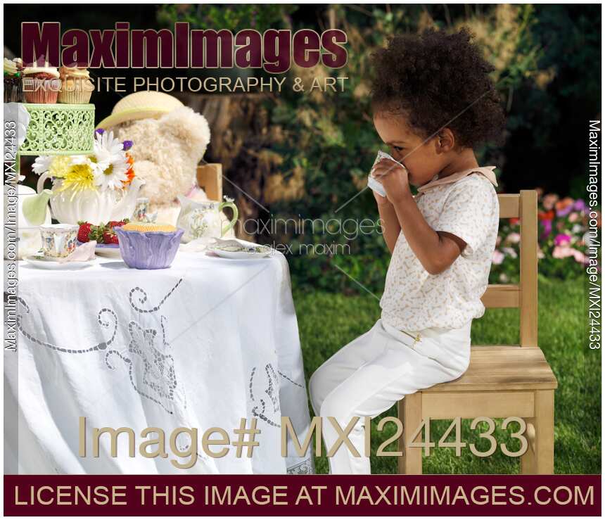 Girl drinking tea at a party table
