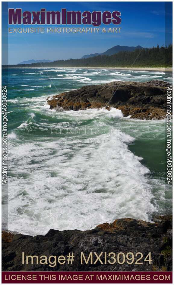 Green Point beach with big tidal waves crashing against the rocks at Pacific Rim National Park Tofino