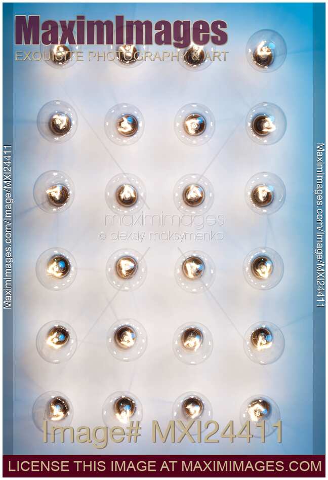 Group of lit light bulbs from above