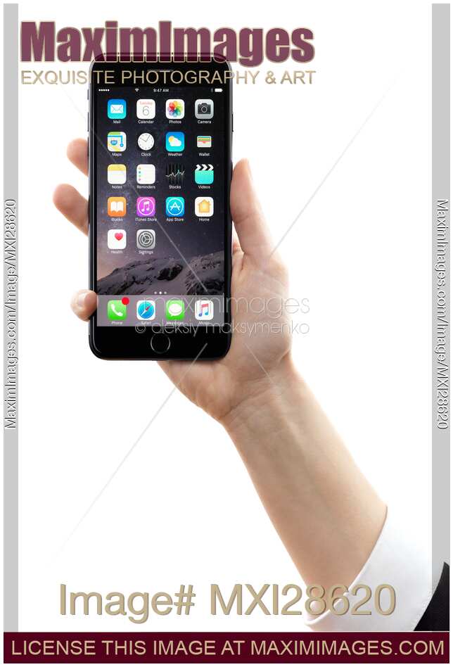 Hand holding Apple iPhone 7 Plus on white background