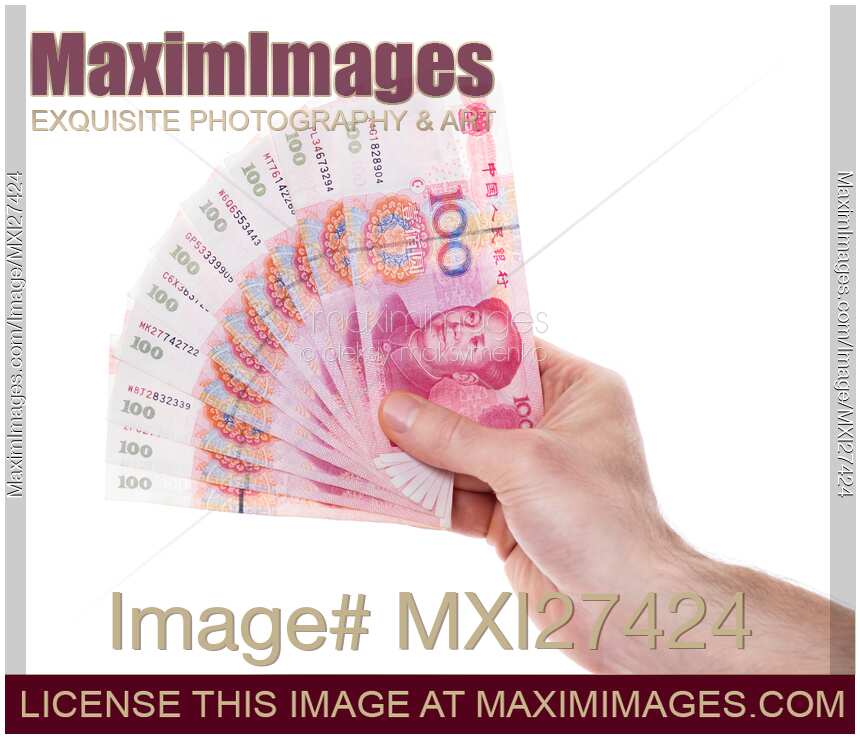 Hand holding Chinese Yuan money bills