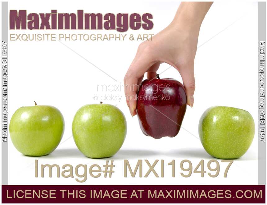 Hand taking a red apple