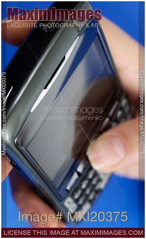 Hand with BlackBerry 8310 Curve Smartphone