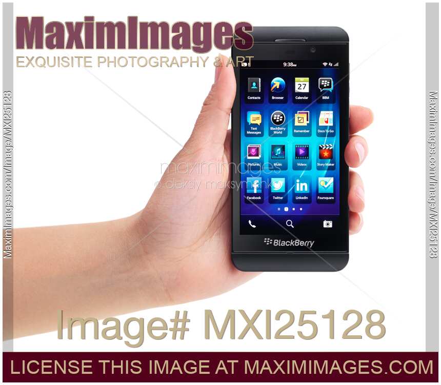 Hand with Blackberry Z10 smartphone