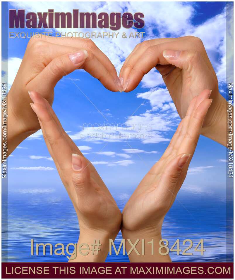 Hands Making Heart Symbol over Blue Sky