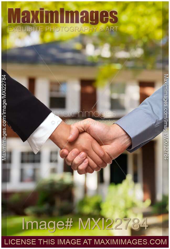 Handshake Between Man and Woman in Front of House
