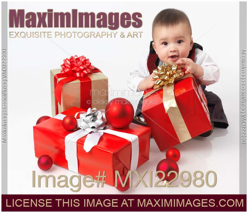 Happy Baby Boy Opening Christmas Presents