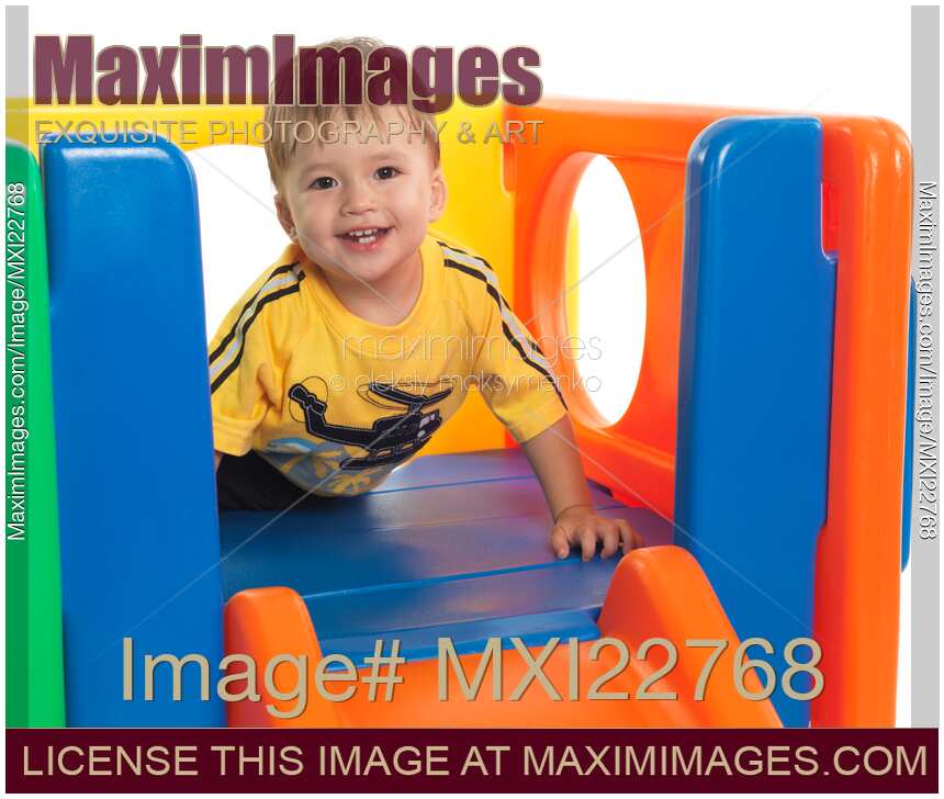 Happy Child Climbing a Slide