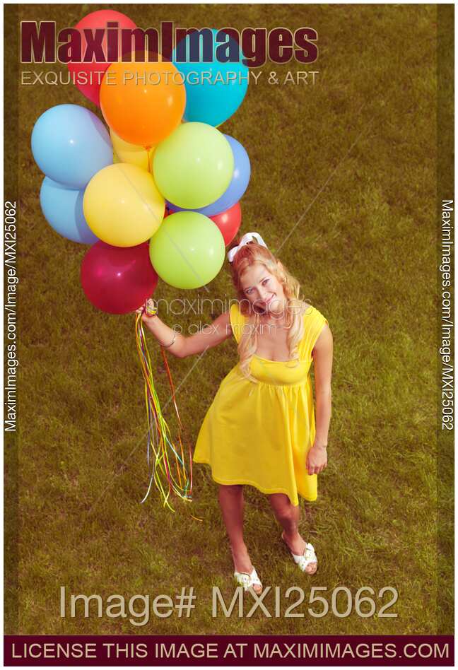 Happy Young Woman with Colorful Balloons