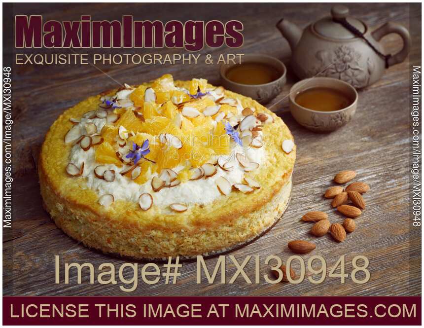 Healthy home-made sugar-free vegan fruit cake artistic food still life with a clay teapot