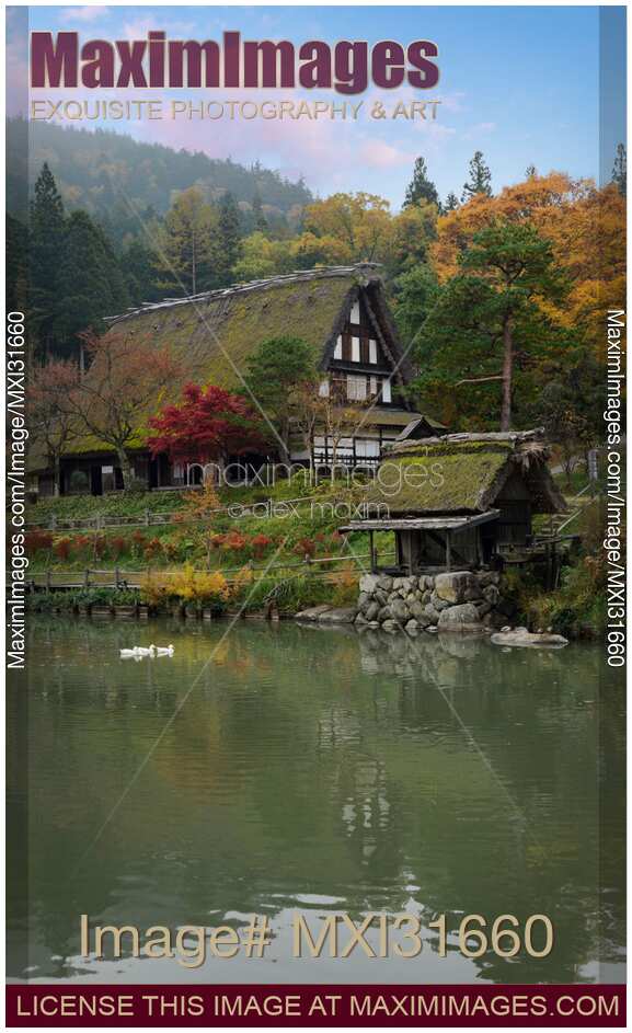 Hida Folk Village rural scenery Traditional Japanese Gassho-style house by a pond in autumn Takayama