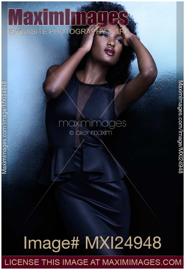 High fashion photo of beautiful black african american woman in black shiny dress