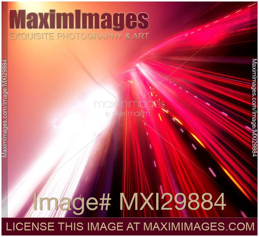 Highway traffic colorful red and white light trails on a foggy night Artistic image
