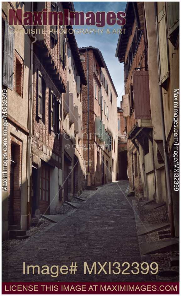 Historic medieval houses along a narrow street of the old town of Albi Southern France