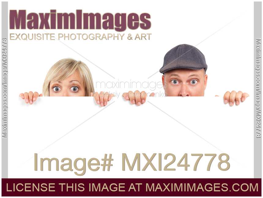 Humorous couple faces behind white sign