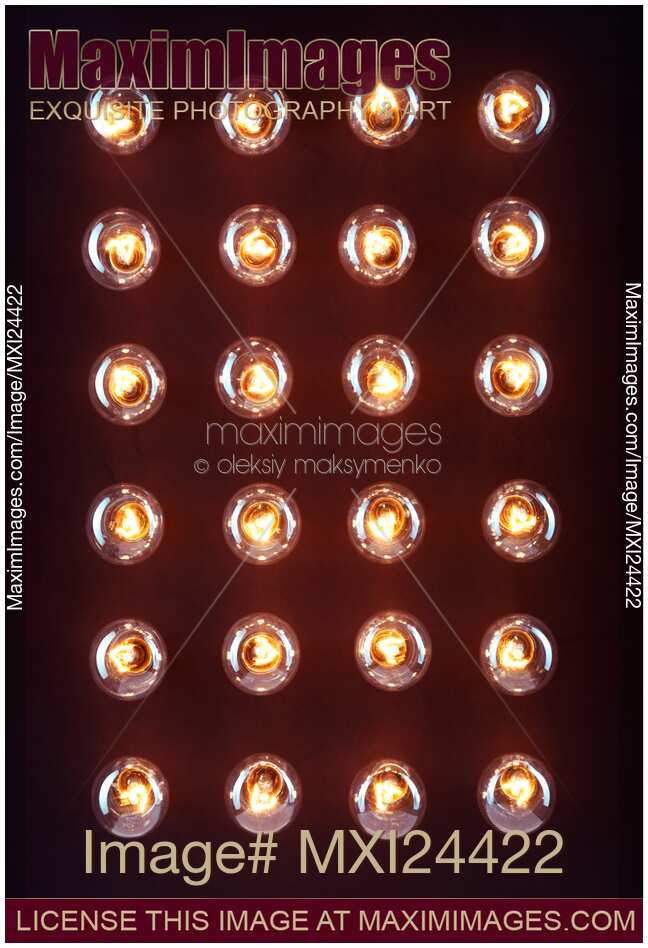 Illuminated light bulbs on black background