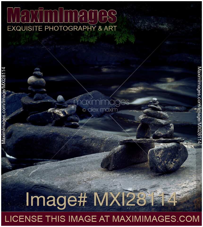 Inuksuk stone figures and river