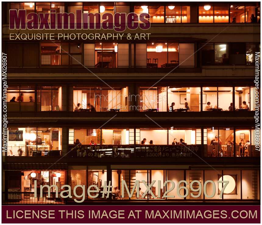 Izumoya Japanese restaurant windows at night in Kyoto