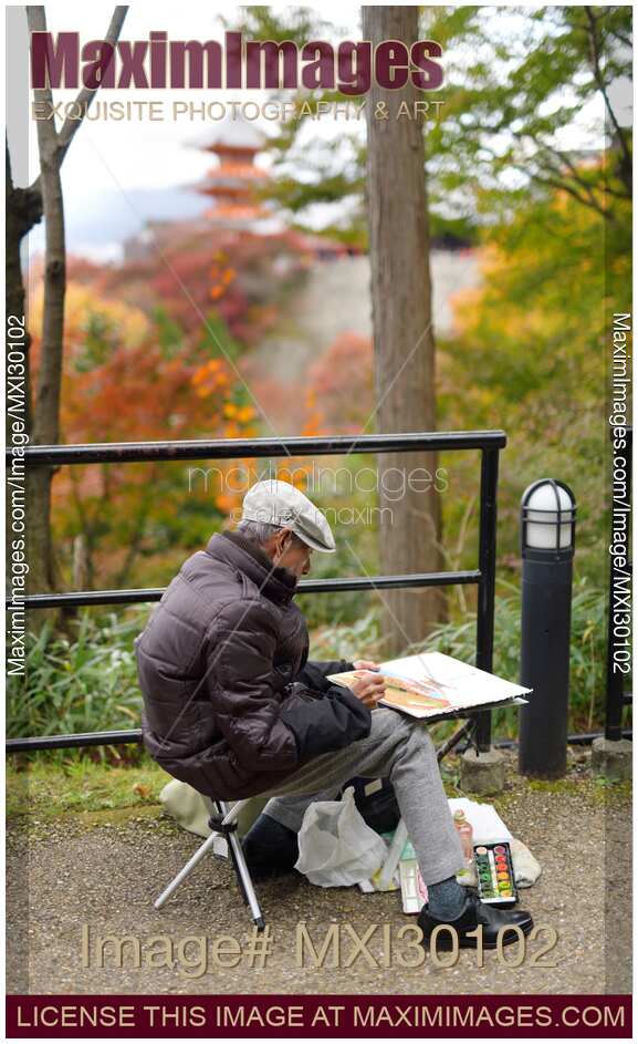 Japanese artist painting Kiyomizu-dera pagoda in autumn Kyoto