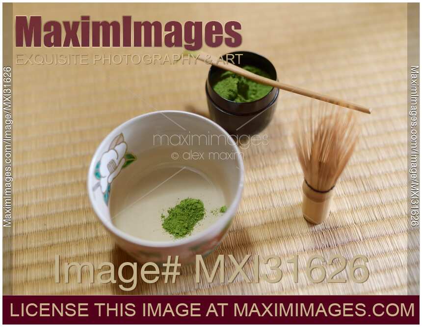 Japanese ceremonial matcha tea set of a bowl with green tea a whisk and a spoon