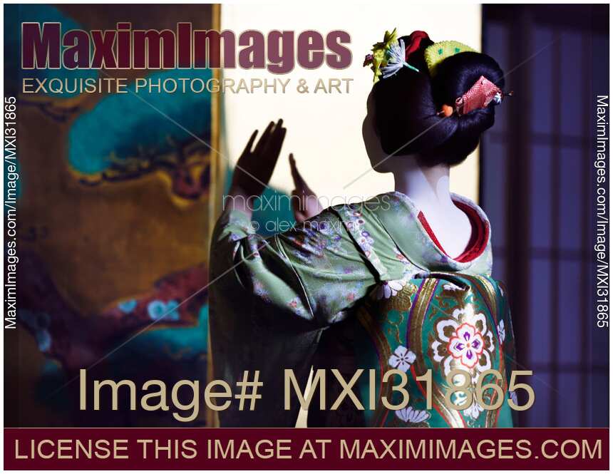 Japanese Maiko gracefully performing a traditional dance closeup of her back showing the nape of her neck