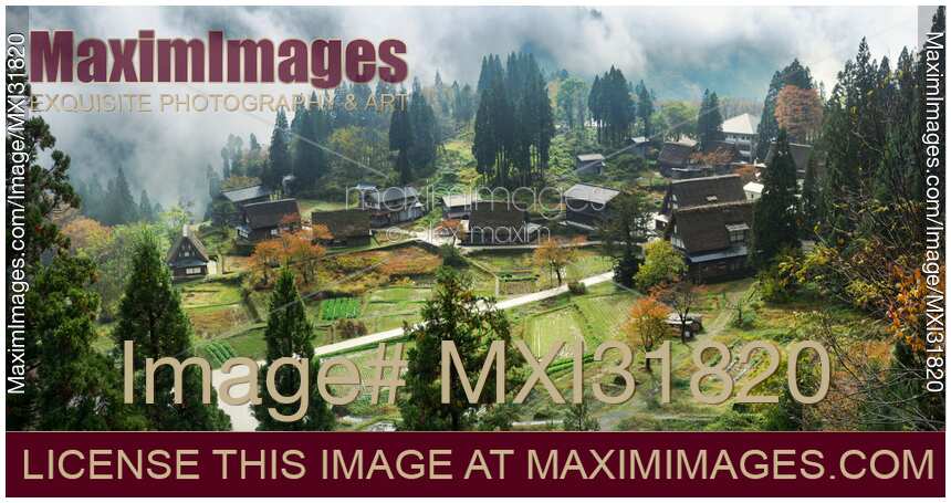 Japanese mountain village Ainokura with Gassho-style traditional rural houses in panoramic aerial autumn scenery