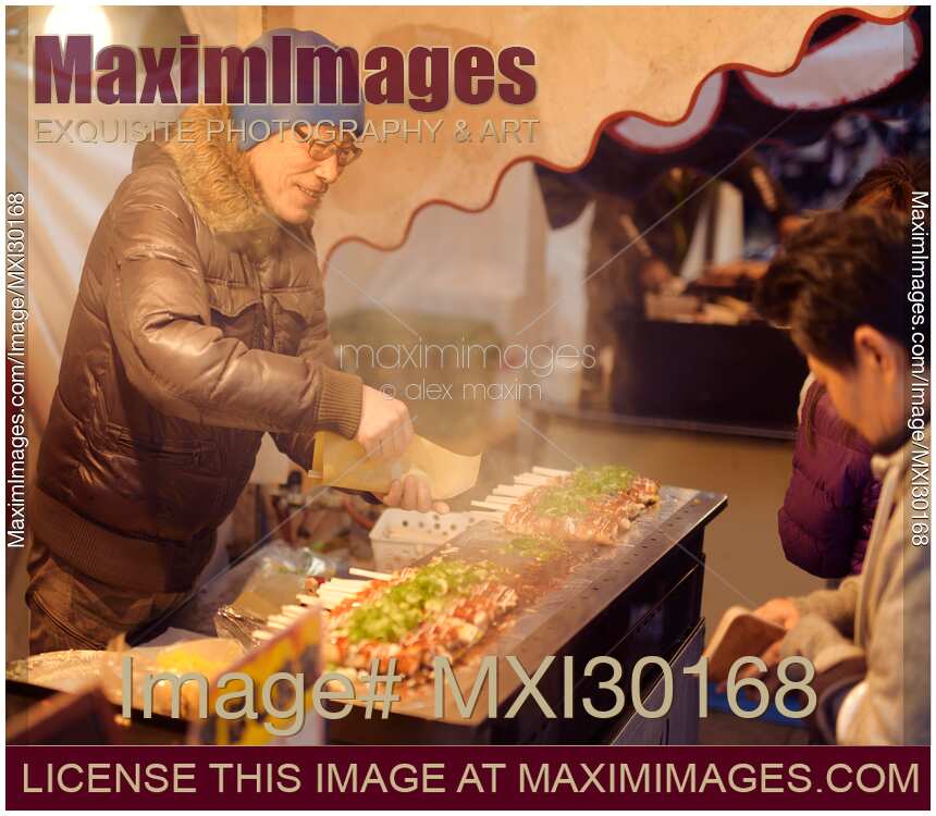 Japanese street food vendor selling Hashimaki at a food market in Kyoto