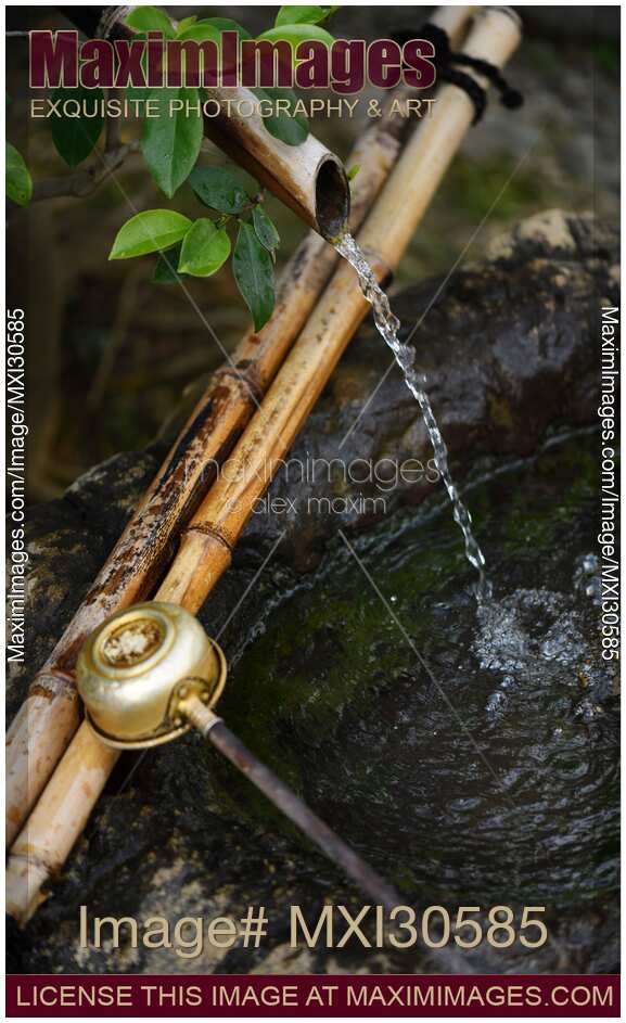 Japanese water cleansing basin with bamboo elements showing Wabi-Sabi philosophy of finding beauty in natural and imperfect