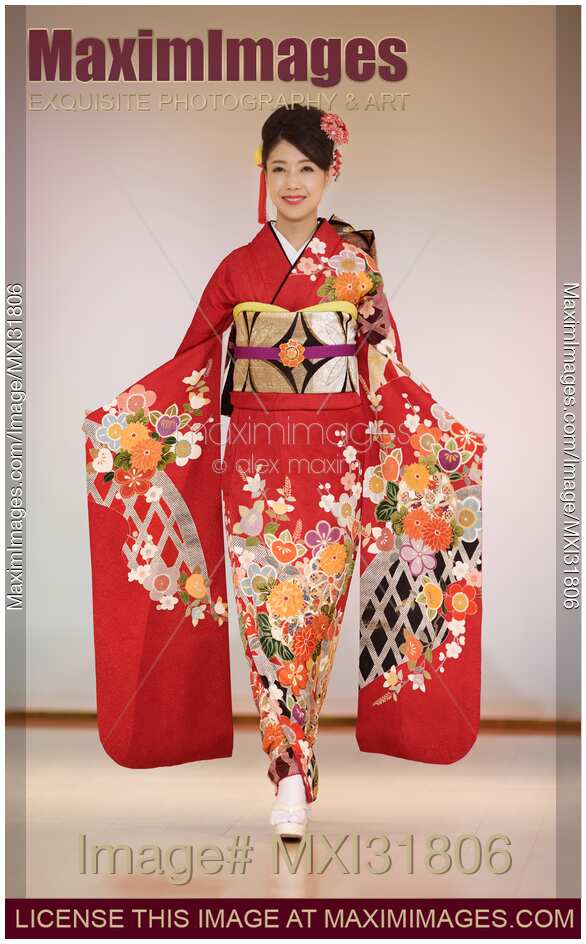 Japanese woman in bright red kimono at fashion show