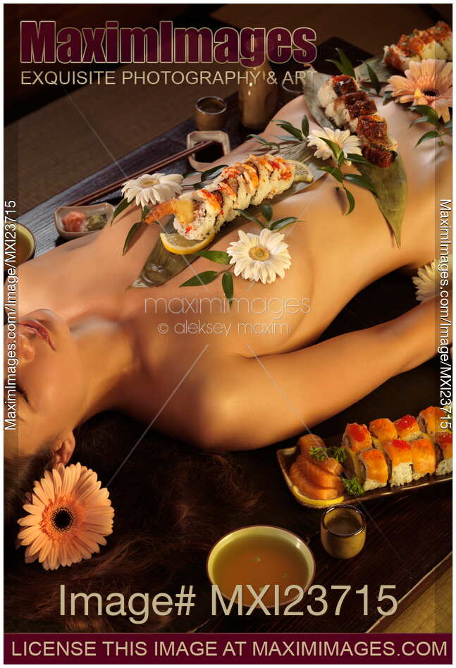 Japanese woman lying with Nyotaimori sushi served on her naked body