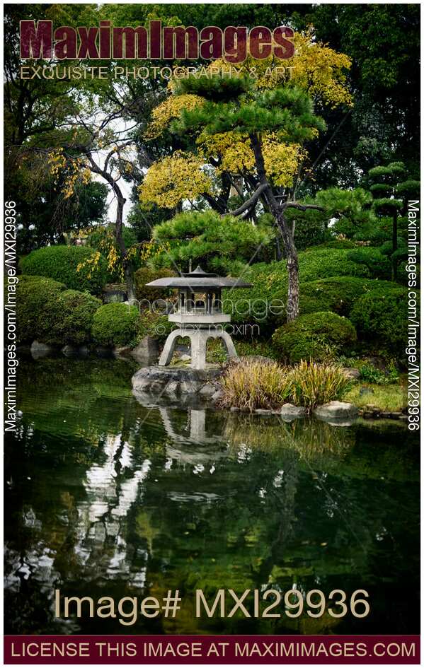 Japanese Zen garden with lantern and pond in Osaka Castle Park