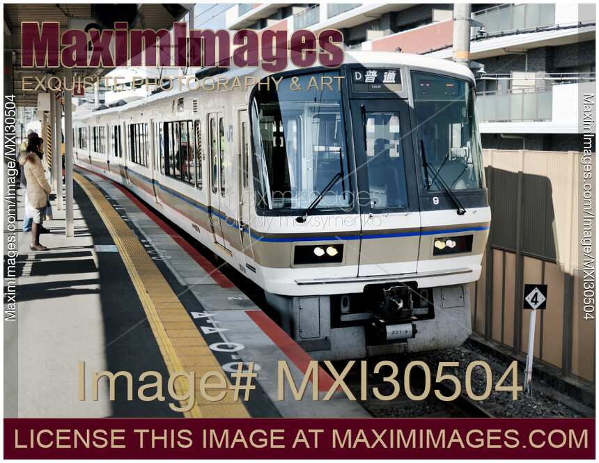 JR train arriving to a station platform in Japan