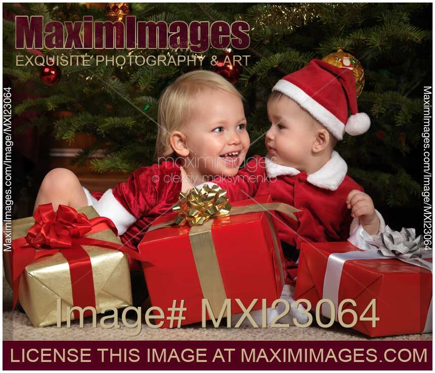 Kids with Gifts under a Christmas Tree