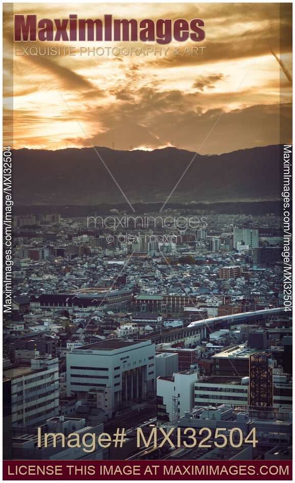 Kyoto aerial city landscape scenery with dramatic sunset skies and arriving Shinkansen train