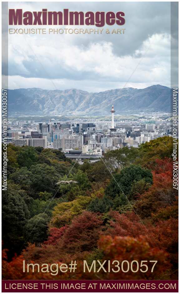 Kyoto tower with mountains and colorful autumn trees aerial city scenery