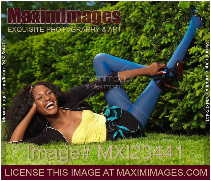 Laughing Young Woman Lying on the Grass