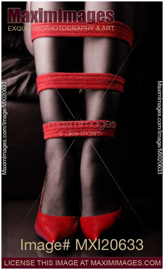 Legs in Red High Heels with Red Bondage Ropes