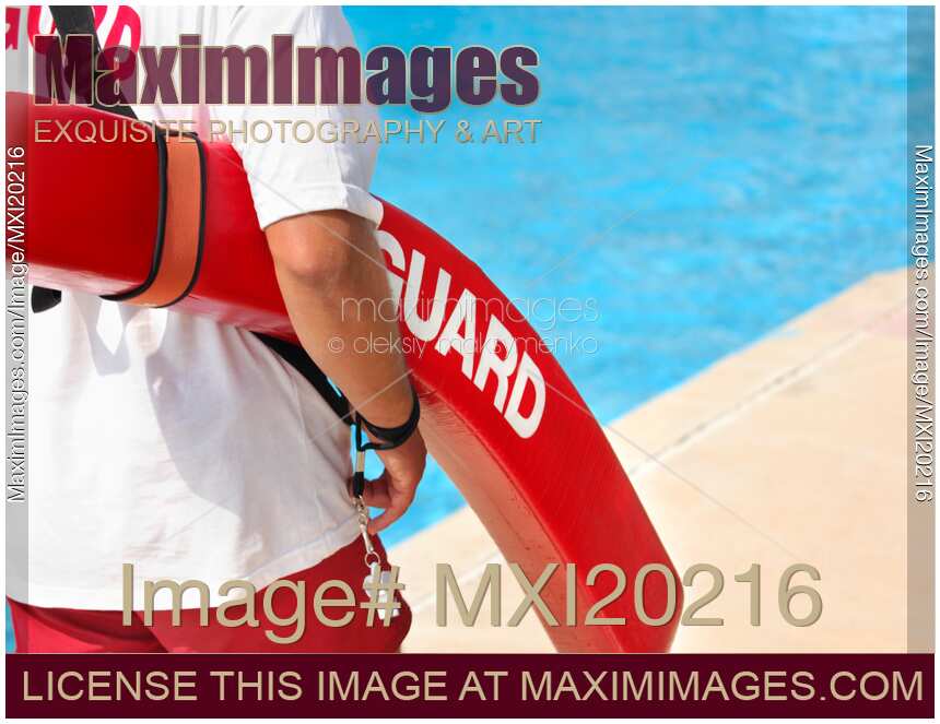 Stock photo Lifeguard on duty at a pool MaximImages