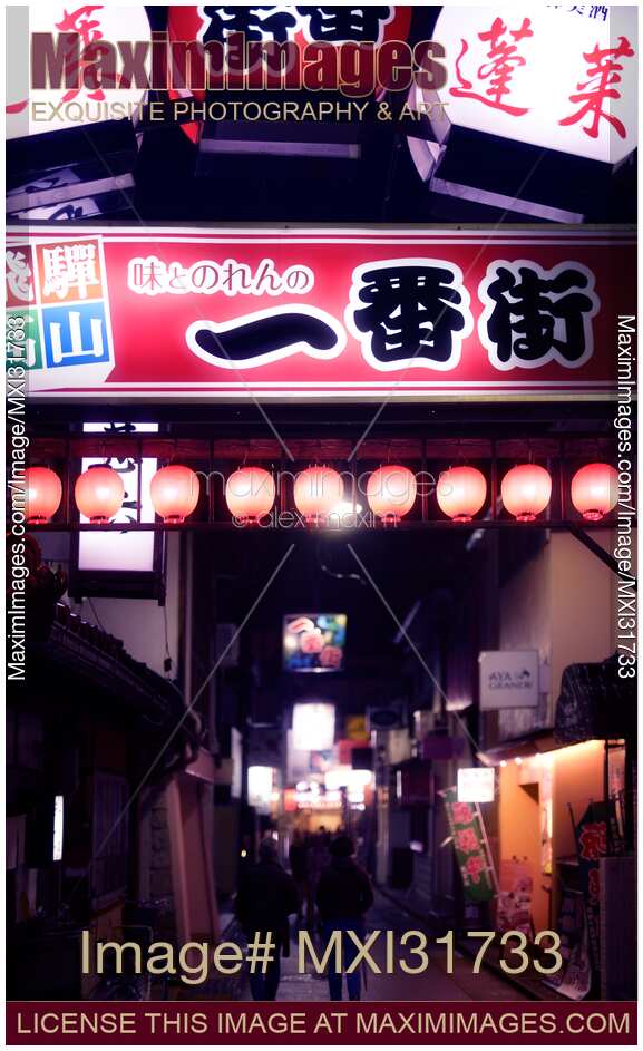 Lit up signs on a street of Takayama city at night