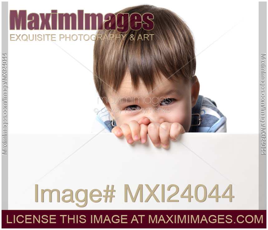 Little boy holding a white sign