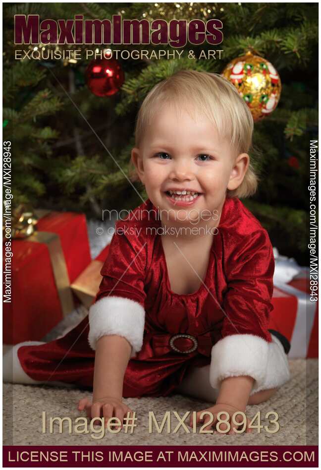 Little Girl near a Christmas Tree