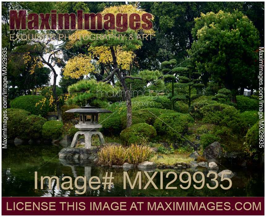 Little Japanese Zen garden with lantern and pond in Osaka Castle Park