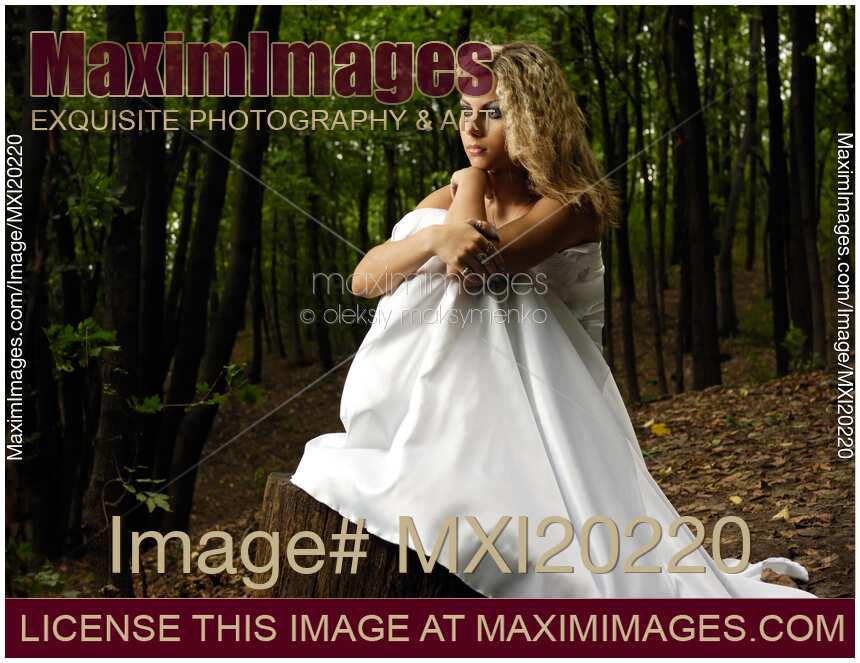 Lonely Bride in Wedding Dress Alone in Woods