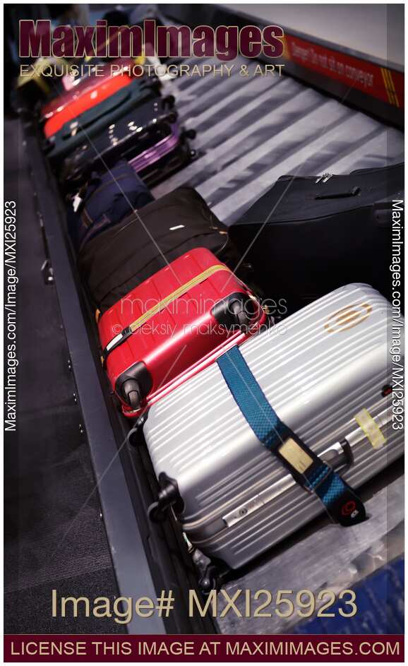 Luggage on airport baggage claim conveyor carousel