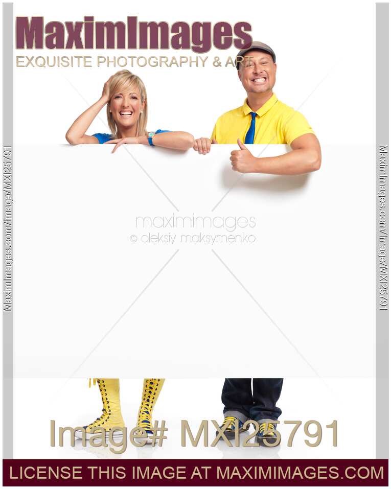 Man and woman behind blank white sign