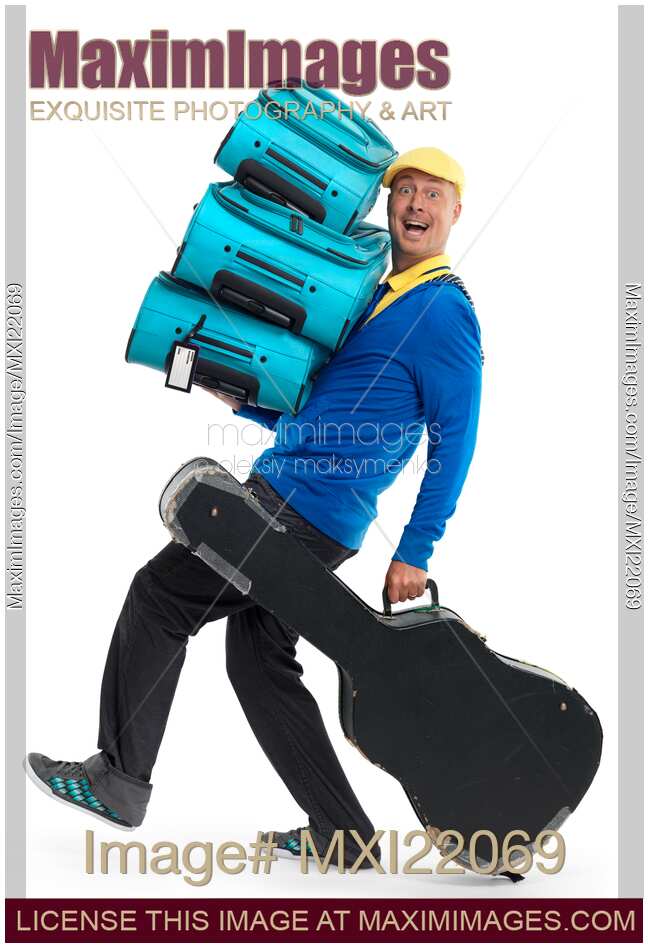Man Carrying a Load of Luggage