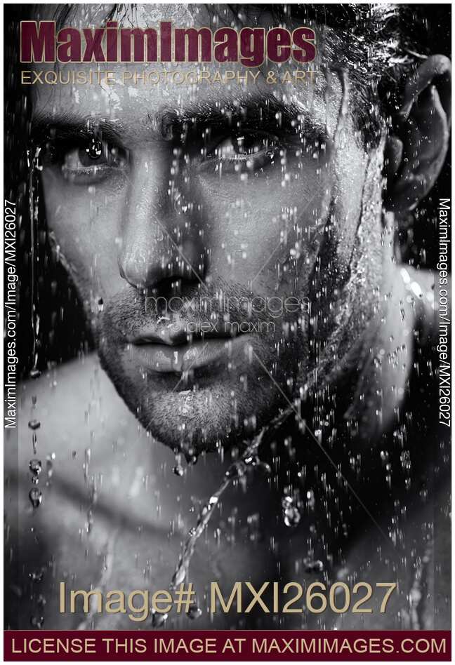 Man face wet from water running down it Black and white