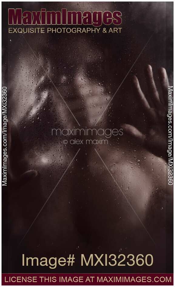 Man hand covering woman mouth silencing or suffocating her behind wet blurry glass in dark