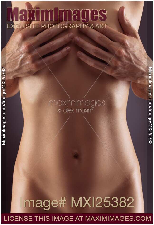 Man hands covering nude woman breasts