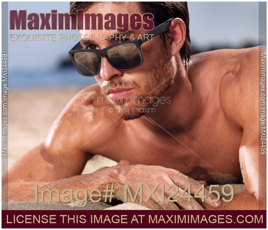 Man in sunglasses at the beach closeup of face